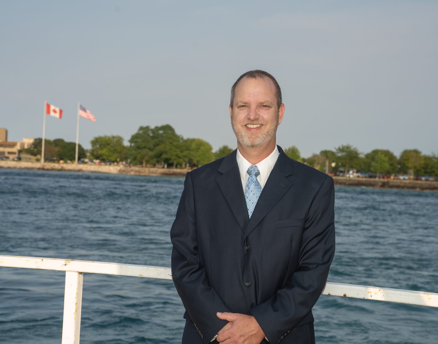 Alan Lewandowski on the Port Huron riverfront with the St. Clair River behind him