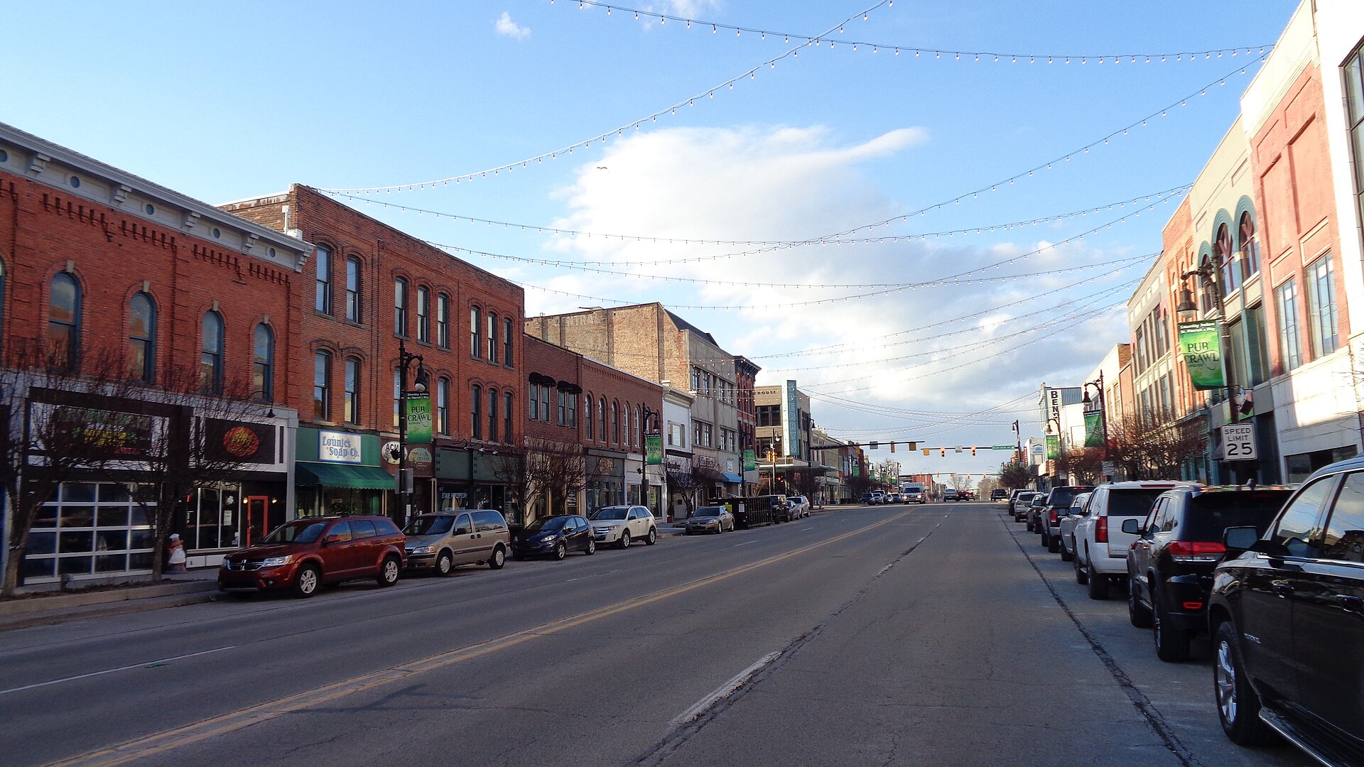 Historic storefronts and string lights along Huron Avenue in downtown Port Huron, Michigan
